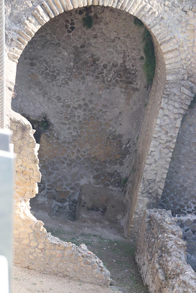 III.1/2/18/19, Herculaneum, October 2023. Room G, remains of structure in north-east corner.
In the east wall, on right, is a doorway into the corridor running at rear of main rooms.
Photo courtesy of Klaus Heese.